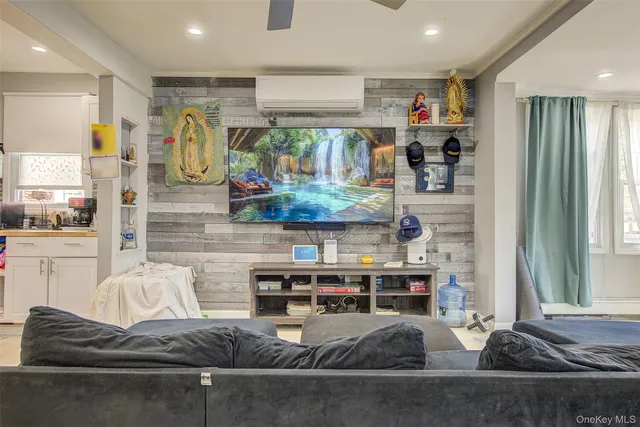 a living room with furniture and a window