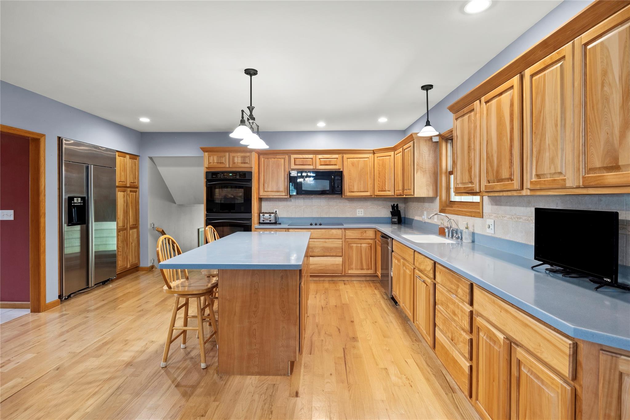 478 High Rock Road New Baltimore, NY 12124 - Photo 17 of 42 a large kitchen with stainless steel appliances kitchen island granite countertop a sink and cabinets