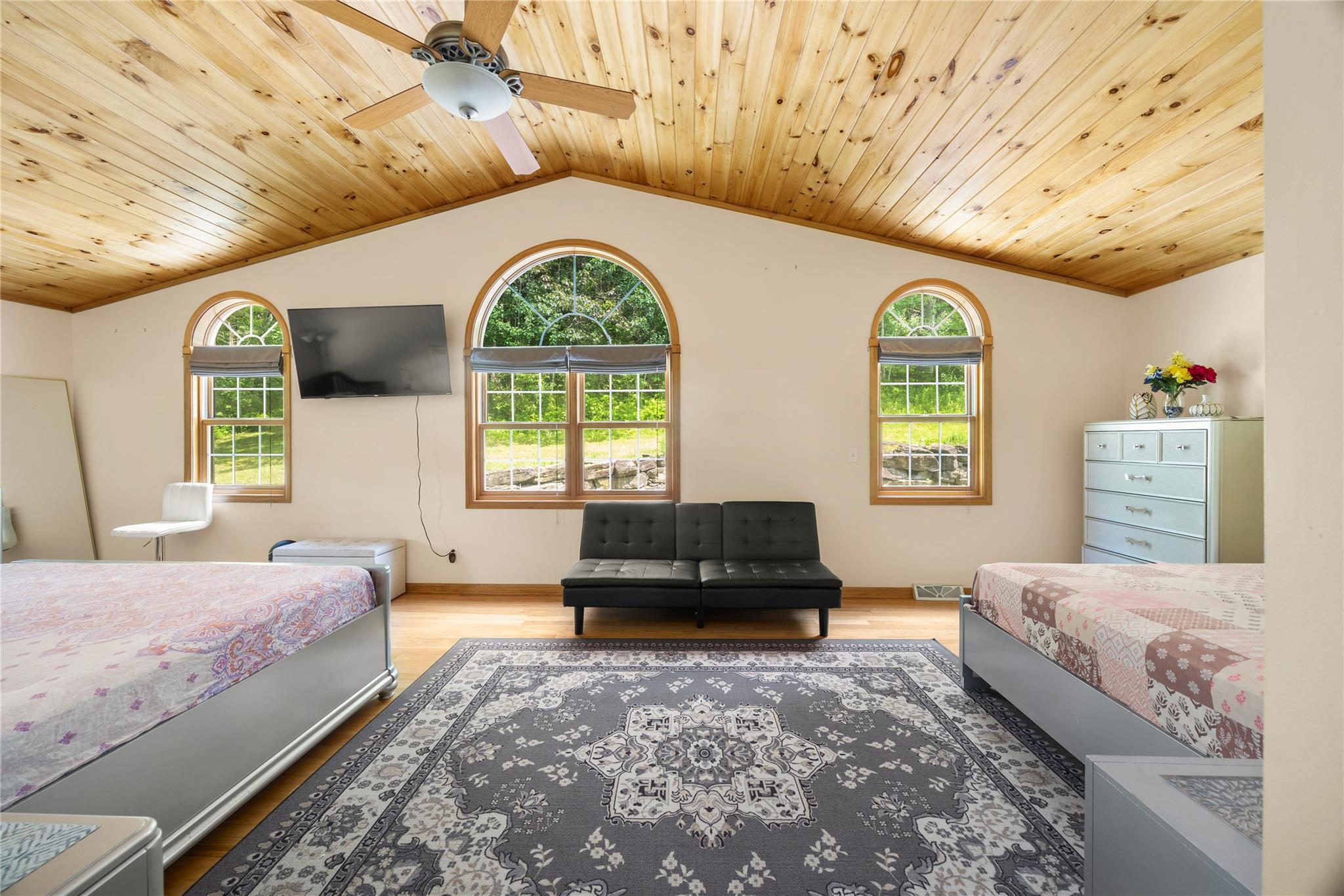 478 High Rock Road New Baltimore, NY 12124 - Photo 23 of 42 a spacious bedroom with a bed and a large window