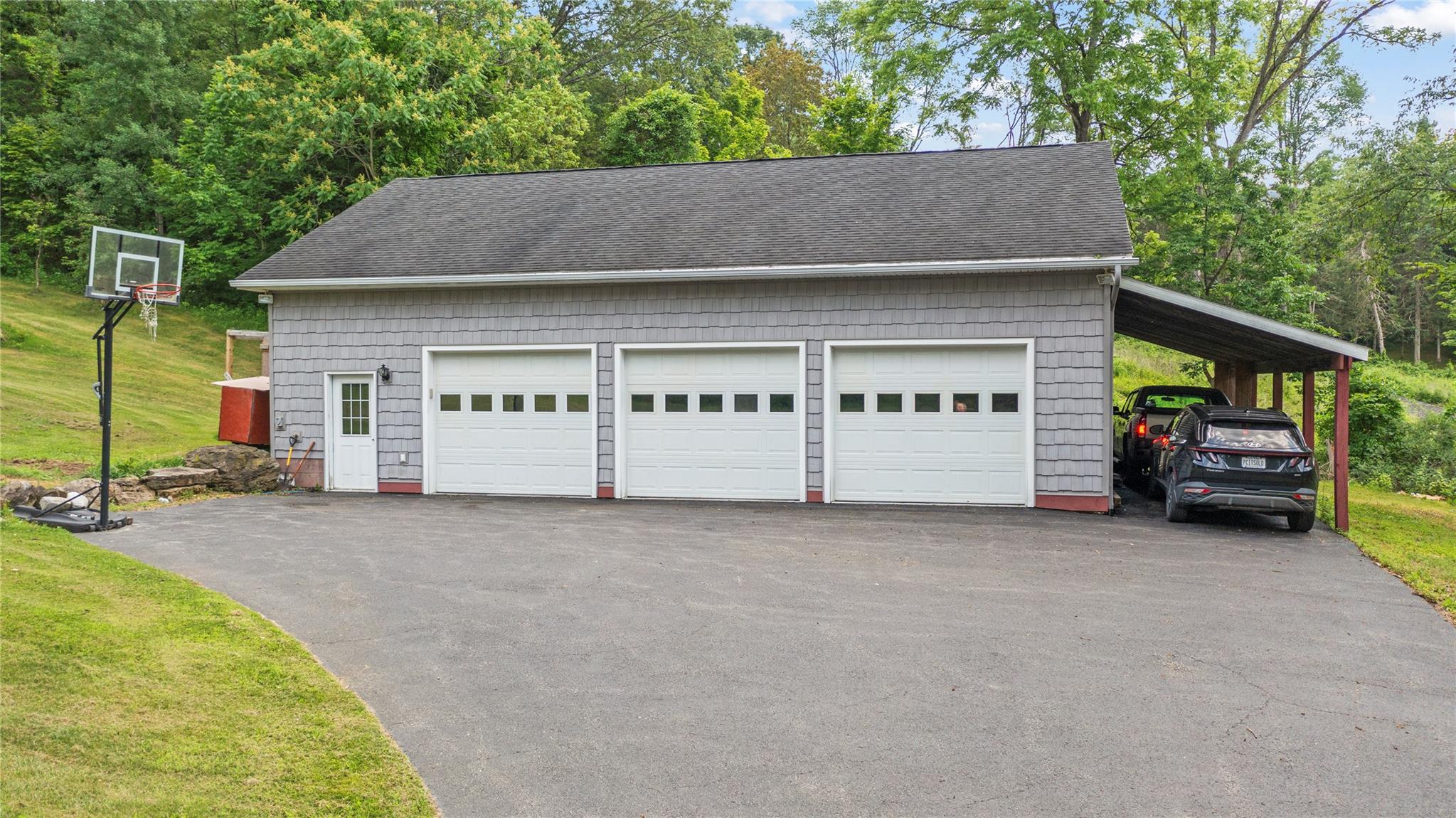 478 High Rock Road New Baltimore, NY 12124 - Photo 30 of 42 a view of a house with a yard and garage