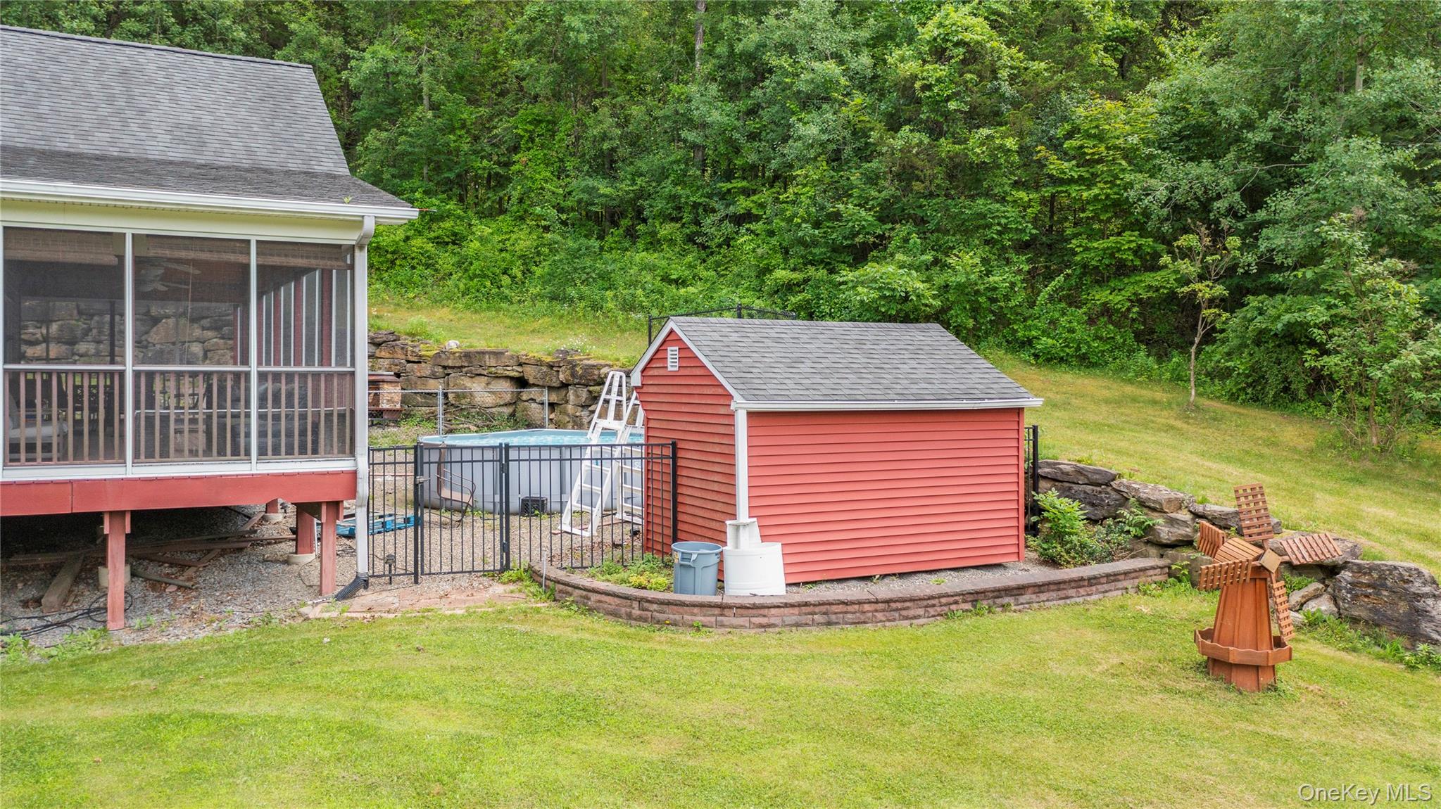 478 High Rock Road New Baltimore, NY 12124 - Photo 35 of 42 a backyard of a house with table and chairs