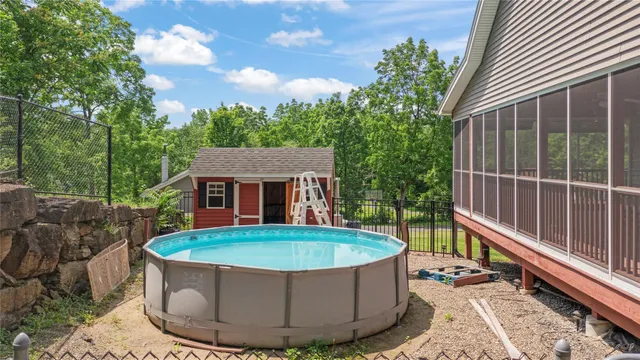 a view of a house with a tub and a yard