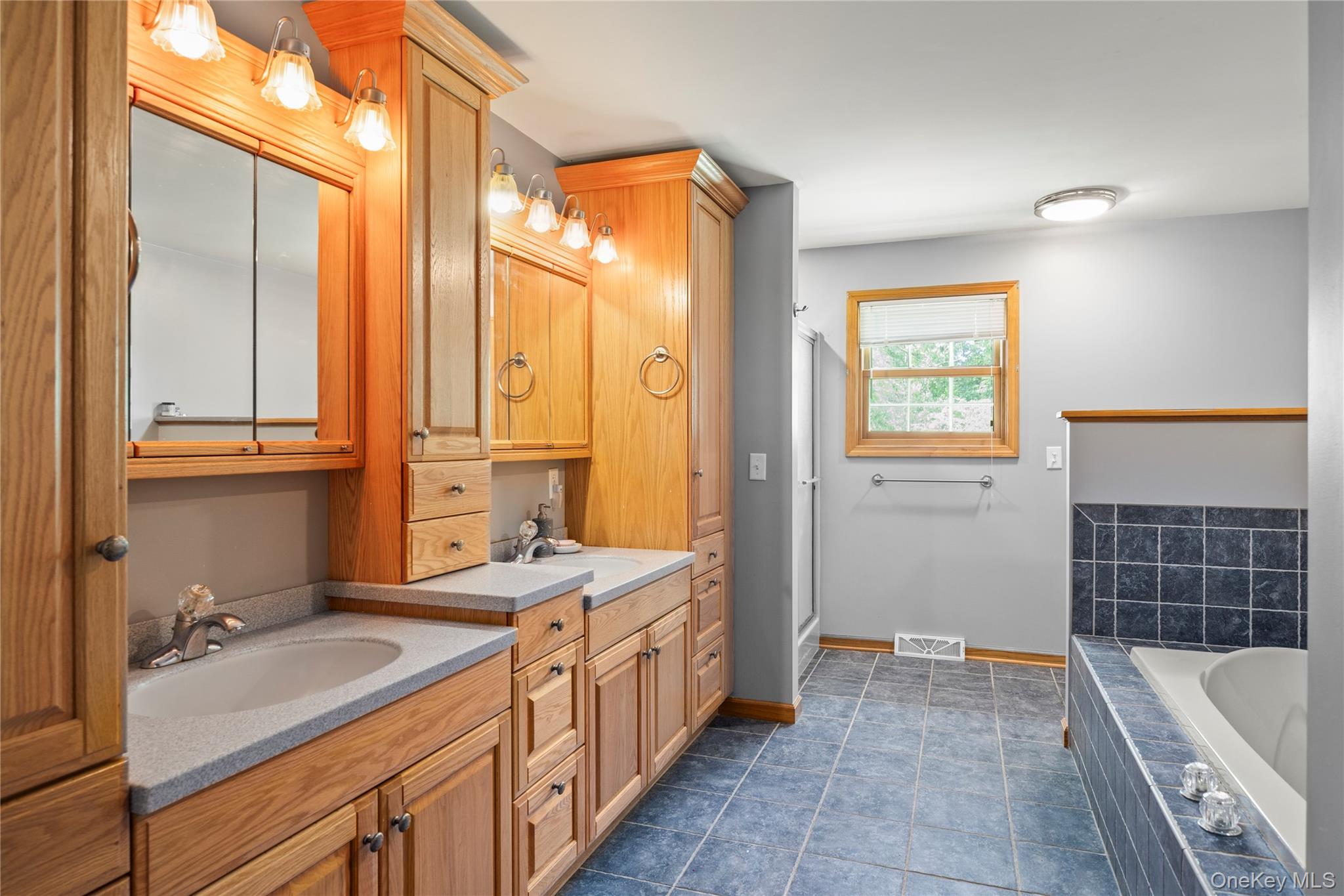 478 High Rock Road New Baltimore, NY 12124 - Photo 4 of 42 a bathroom with a tub sink and mirror