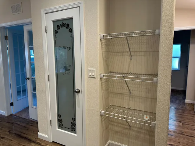 a view of a livingroom with wooden floor