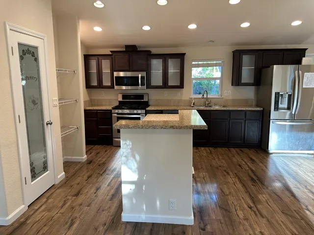 a view of entryway with wooden floor