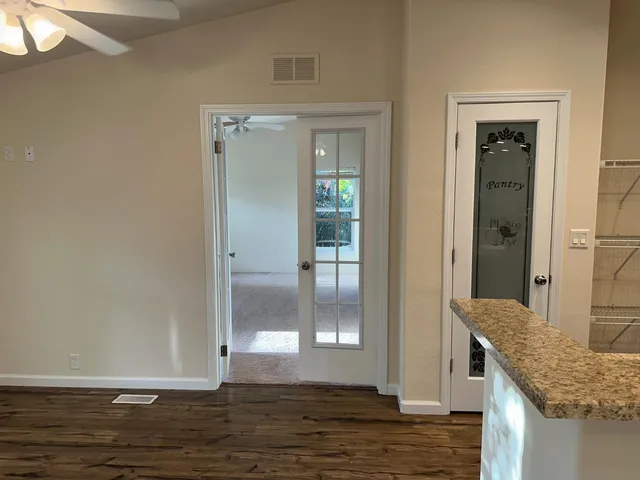 a view of an empty room with a window