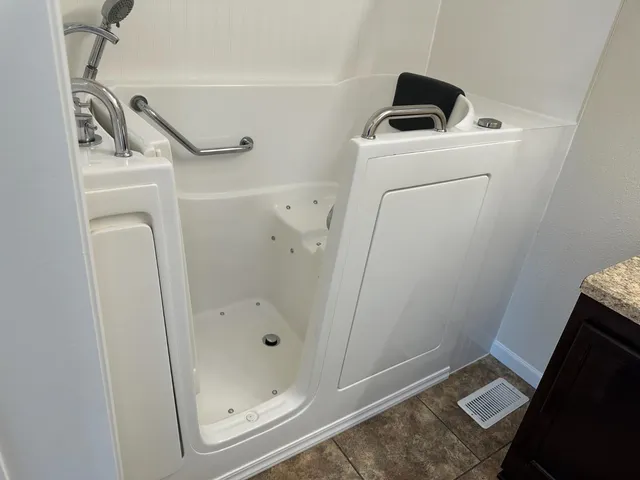 a view of balcony with wooden floor and fence