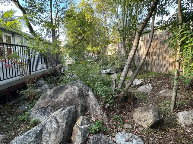 a view of a porch with wooden floor
