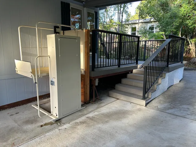 a backyard of a house with a yard and outdoor seating