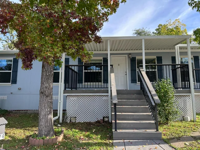 a backyard of a house with lots of green space