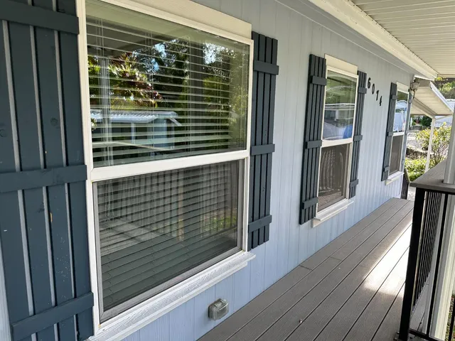 a view of balcony with wooden floor
