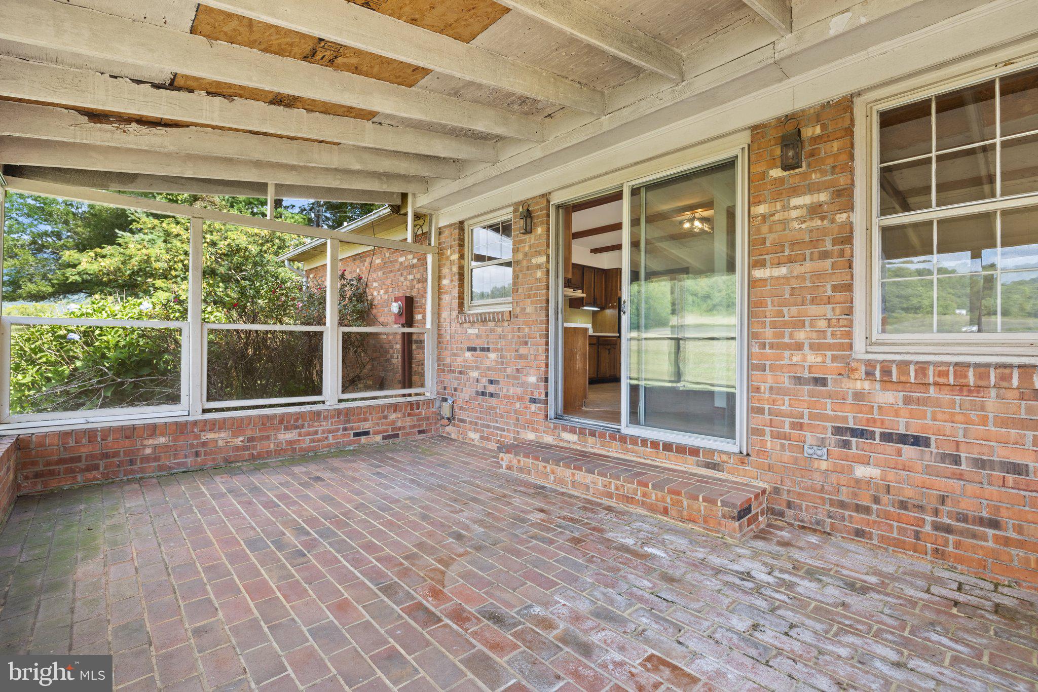 95 Harris Hollow Road Washington, VA 22747 - Photo 60 of 81 Bricked patio/screen porch
