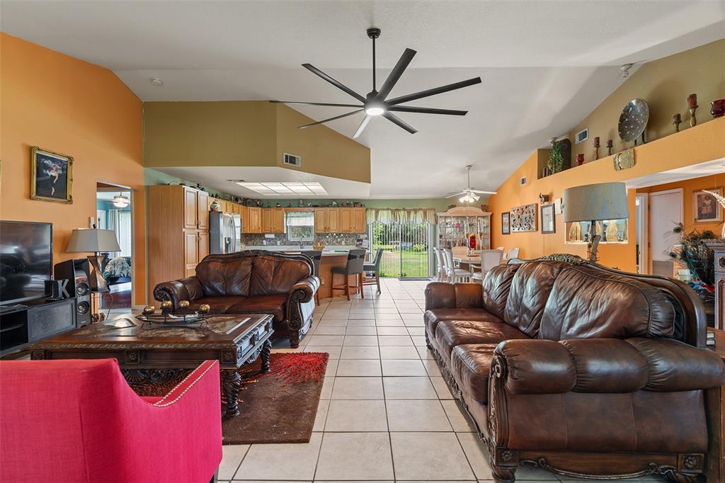 2830 Horton Road Kissimmee, FL 34744 - Photo 5 of 35 a living room with furniture a ceiling fan and a rug