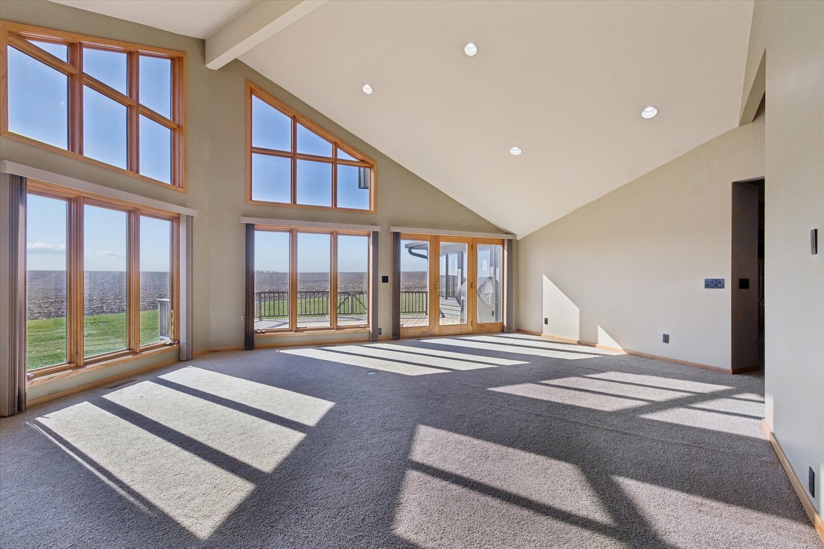 97 Highcrest Court Shannon, IL 61078 - Photo 12 of 58 a spacious bedroom with a large window and a balcony
