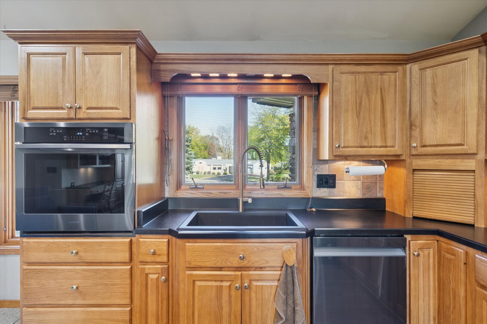 97 Highcrest Court Shannon, IL 61078 - Photo 24 of 58 a kitchen with granite countertop a sink and a stove
