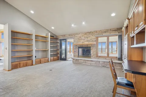 a bathroom with a granite countertop sink a mirror and a shower