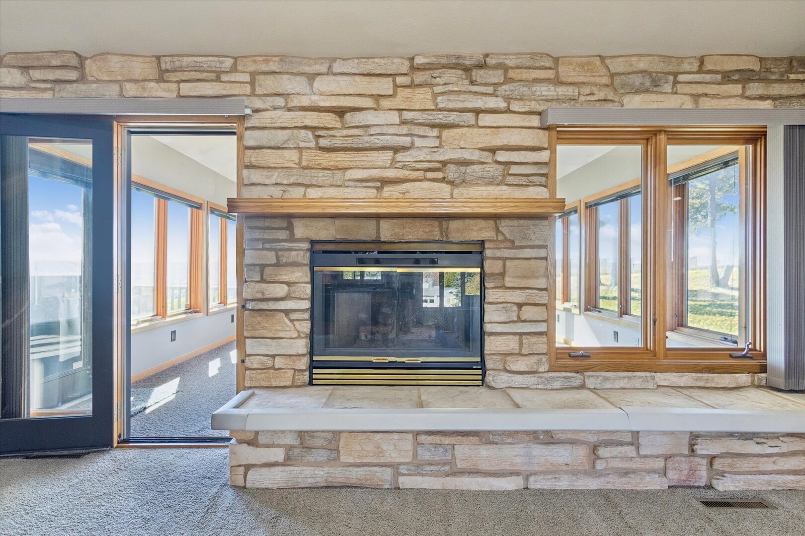 97 Highcrest Court Shannon, IL 61078 - Photo 27 of 58 a living room with a fireplace and a floor