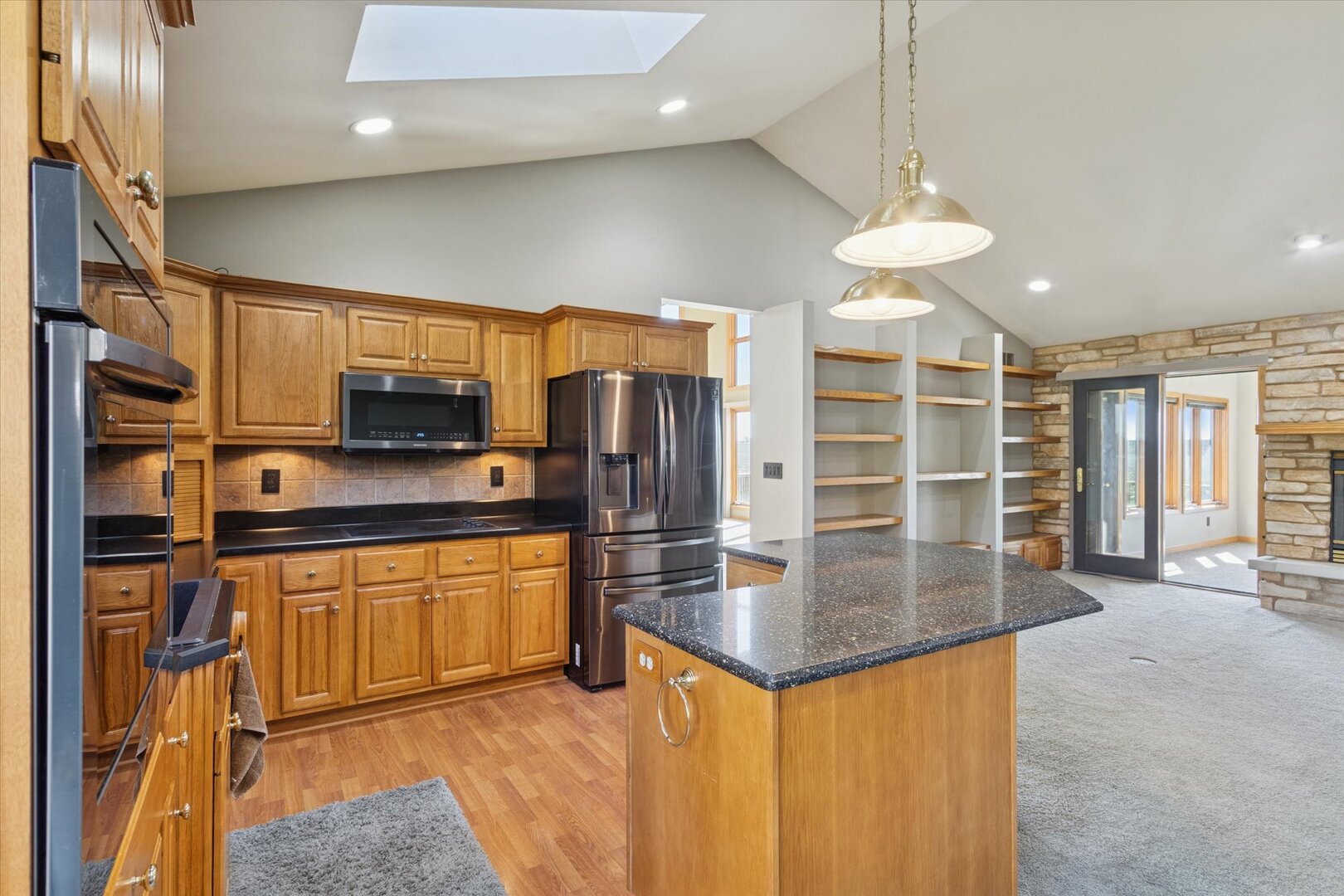 97 Highcrest Court Shannon, IL 61078 - Photo 7 of 58 a kitchen with stainless steel appliances granite countertop a sink refrigerator and microwave