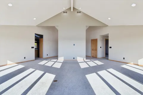 a view of a hallway with a washer and dryer