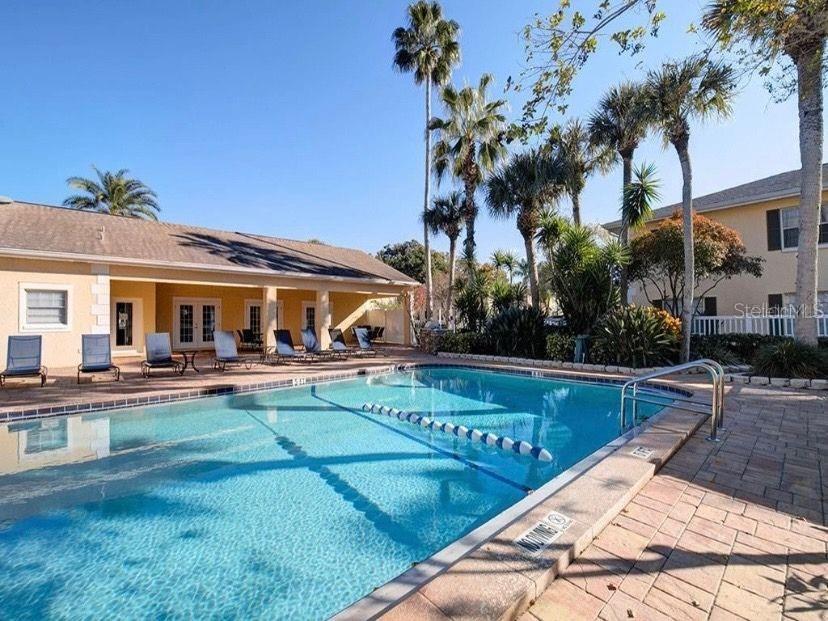 13125 Wilcox Road, Unit 6205 Largo, FL 33774 - Photo 39 of 48 a view of a house with swimming pool and sitting area
