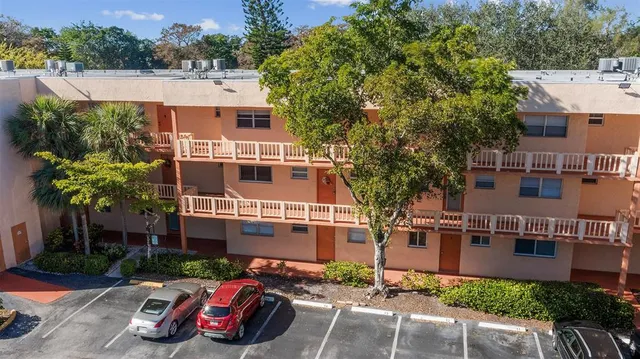 an aerial view of a house with a garden and plants