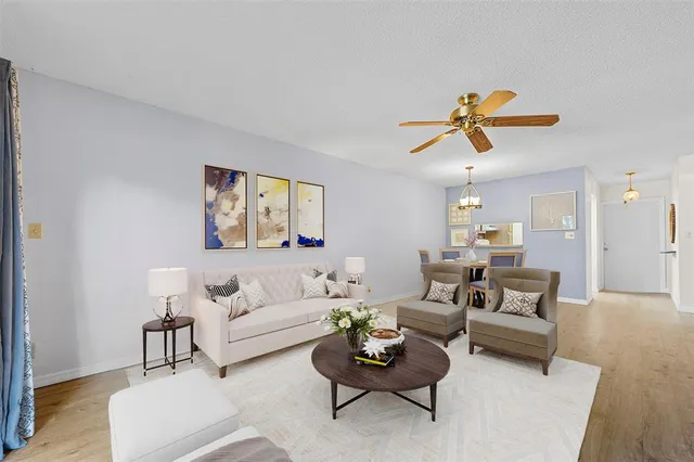 a spacious bedroom with a bed and a cabinets