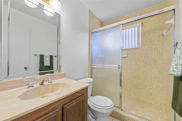 a view of a chair and table in the balcony