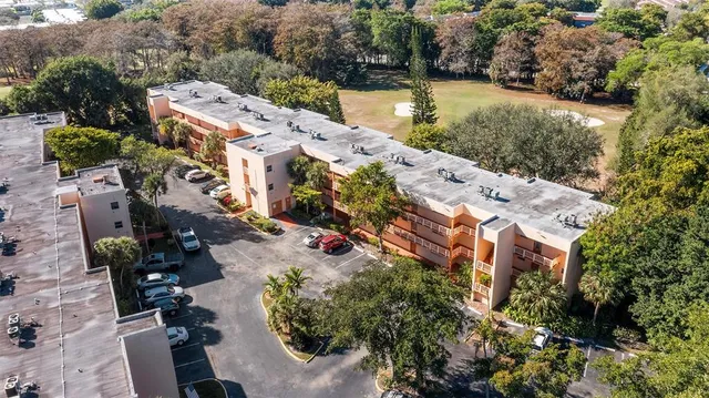 an aerial view of a house with outdoor space