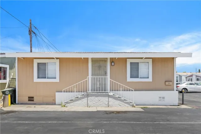 a view of a house with a street