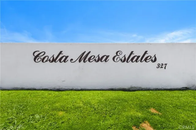 a view of outdoor space with garden and wooden fence