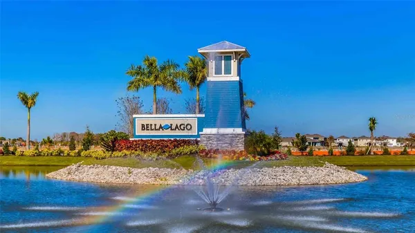 an aerial view of a swimming pool with a table and chairs