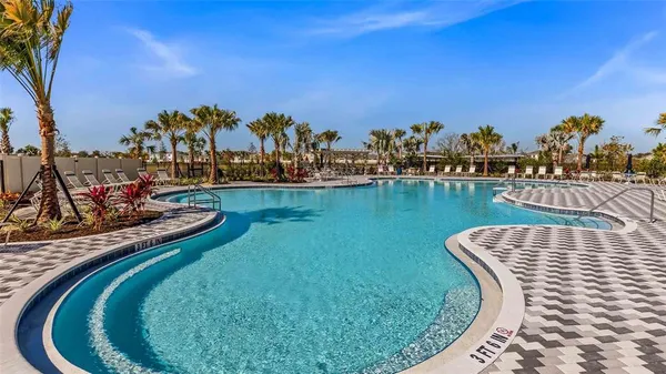 a front view of a house with swimming pool yard and outdoor seating