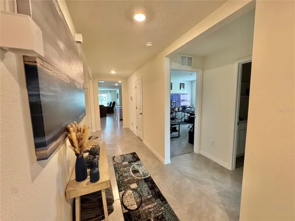 a view of a livingroom with furniture and front door