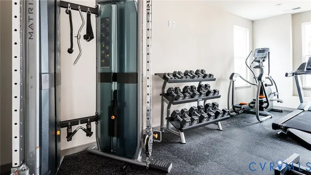 a view of a chairs and table in the balcony