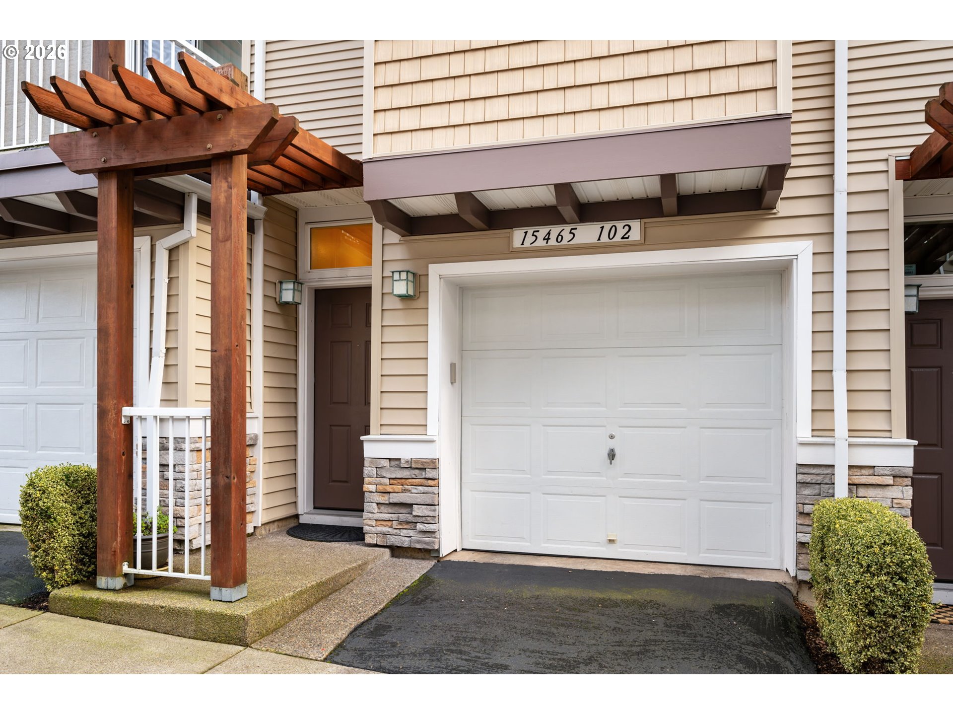 15465 Southwest Sparrow Loop, Unit 102 Beaverton, OR 97007 - Photo 2 of 44 a view of a street with an outdoor space