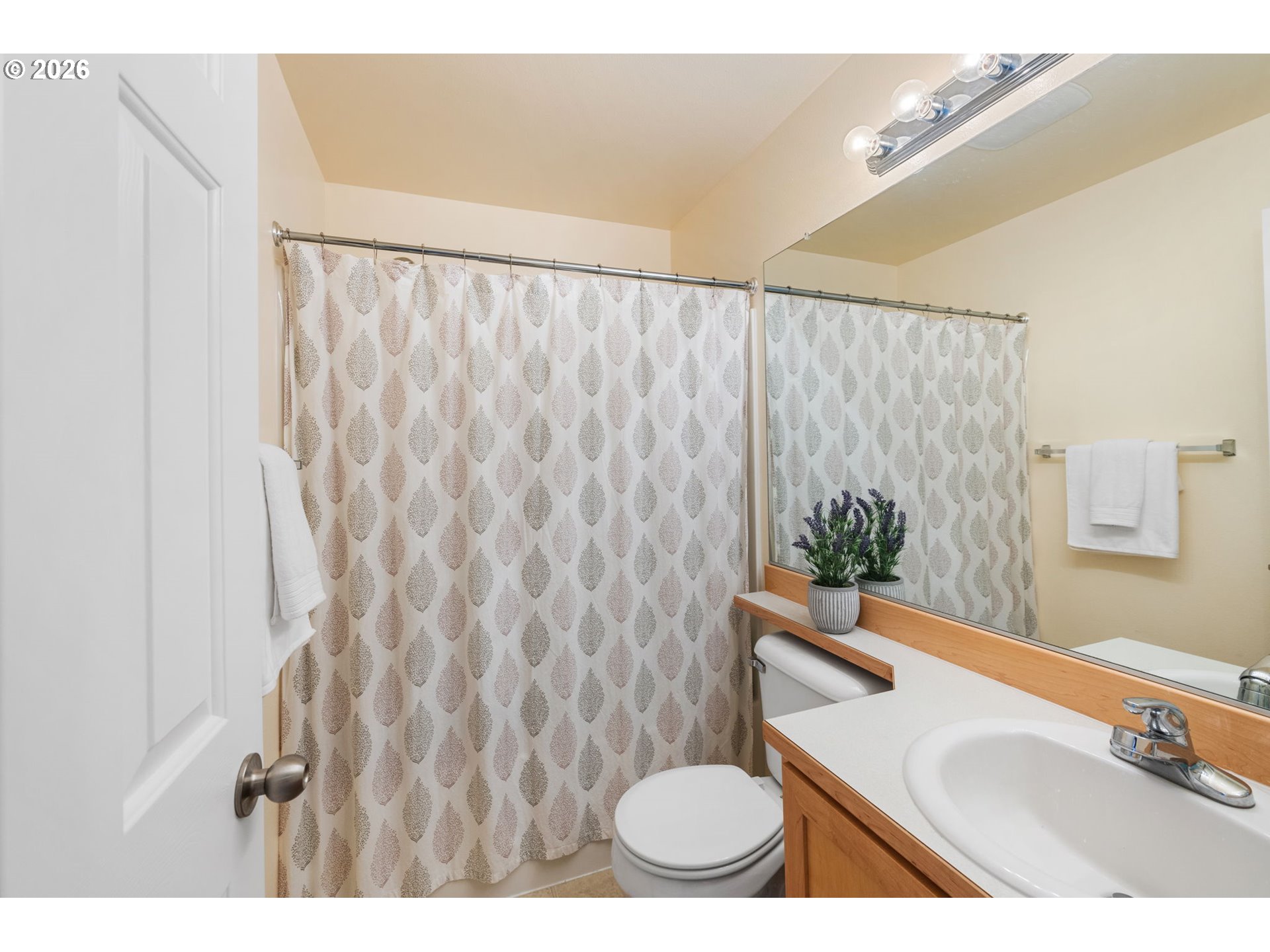15465 Southwest Sparrow Loop, Unit 102 Beaverton, OR 97007 - Photo 23 of 44 a bathroom with a sink toilet and shower