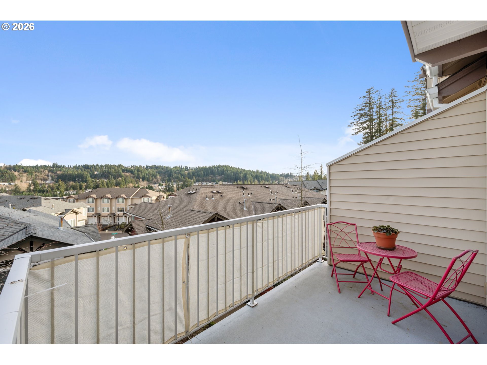 15465 Southwest Sparrow Loop, Unit 102 Beaverton, OR 97007 - Photo 27 of 44 a view of a two chairs in the balcony