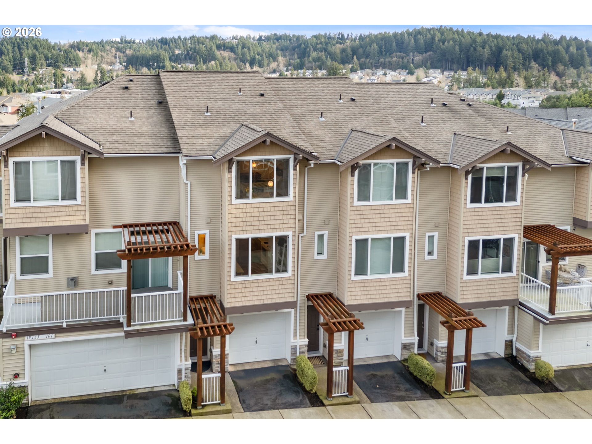 15465 Southwest Sparrow Loop, Unit 102 Beaverton, OR 97007 - Photo 33 of 44 a aerial view of a residential apartment building with a yard
