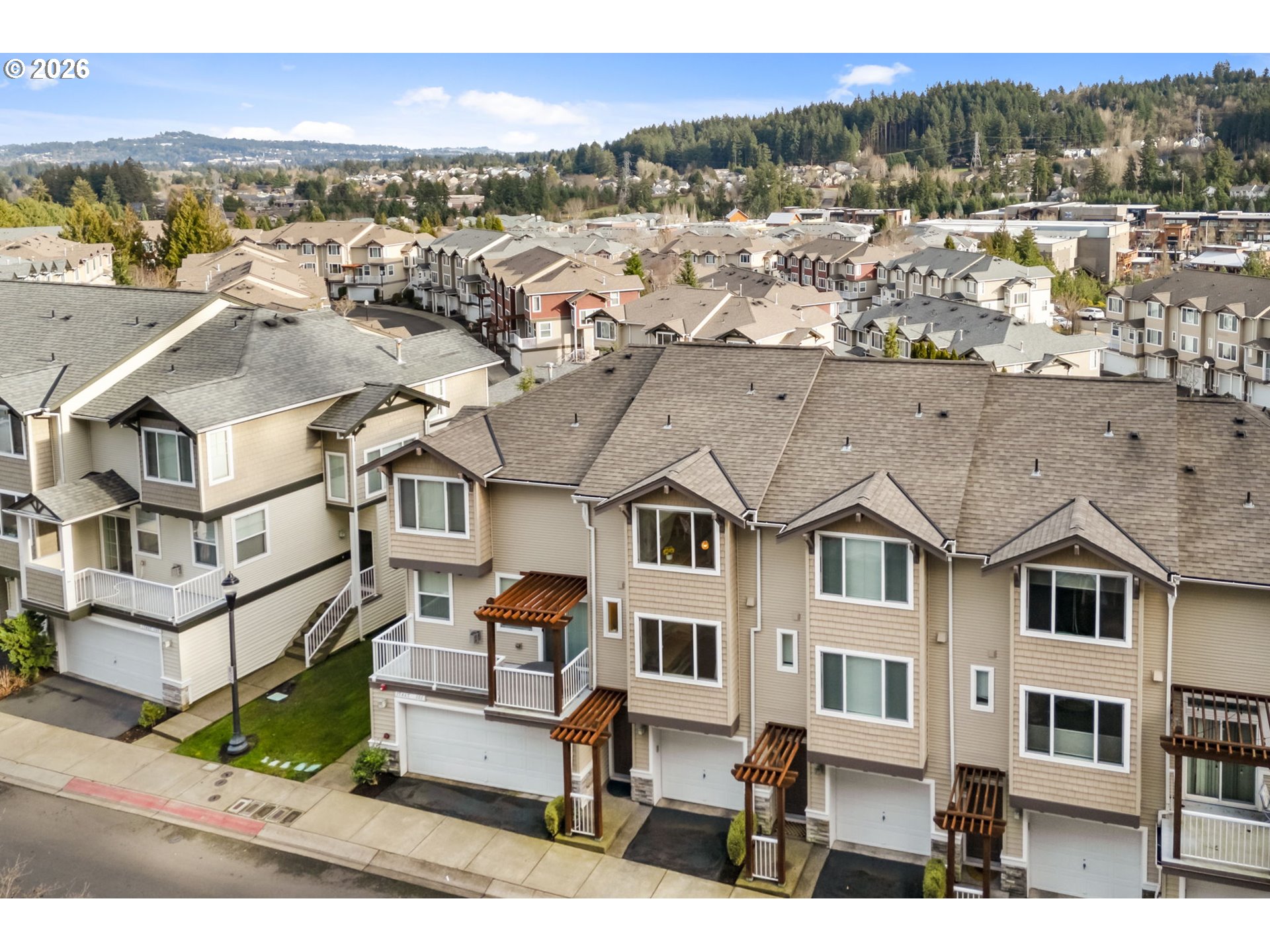 15465 Southwest Sparrow Loop, Unit 102 Beaverton, OR 97007 - Photo 34 of 44 a view of a city with tall buildings