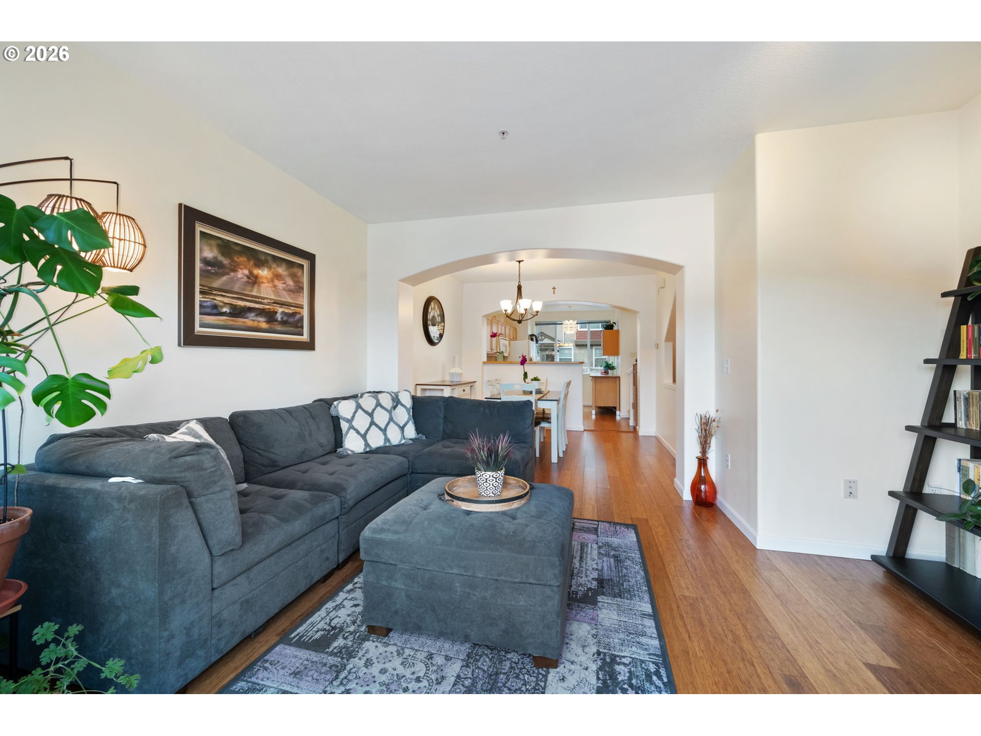 15465 Southwest Sparrow Loop, Unit 102 Beaverton, OR 97007 - Photo 6 of 44 a living room with furniture and a wooden floor