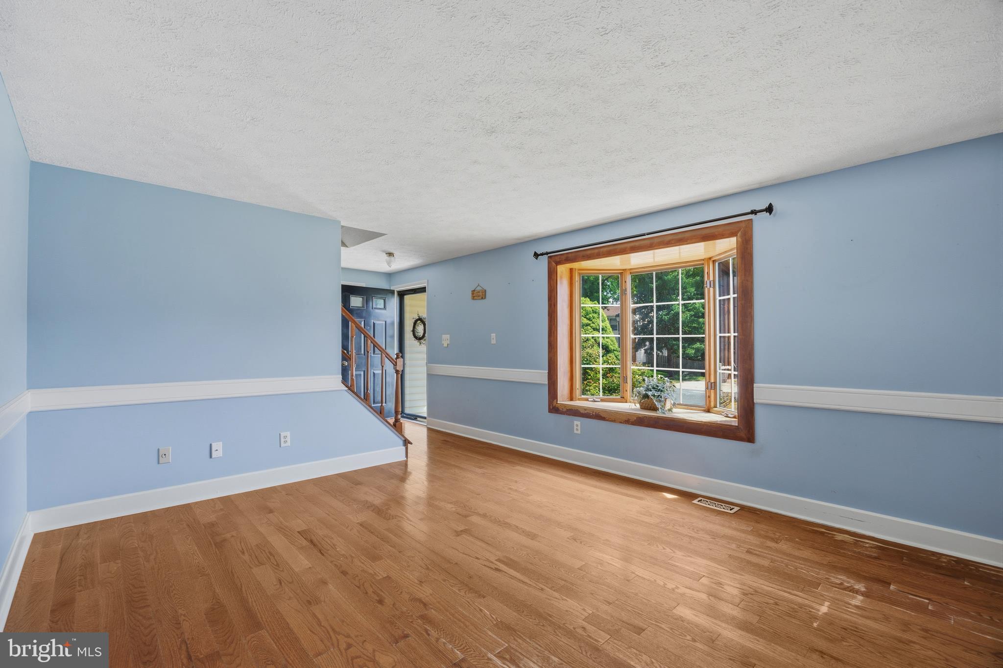 1506 Gollum Road Hanover, MD 21076 - Photo 8 of 44 a view of an empty room with a window and wooden floor