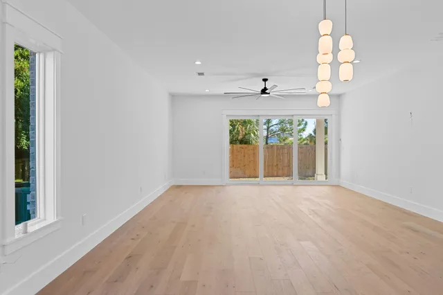 a bedroom with a large bed and a large window