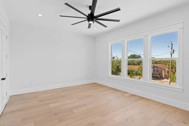 an aerial view of a house with a garden and swimming pool