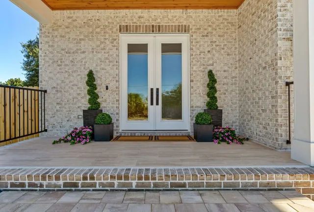 an empty room with wooden floor and a window
