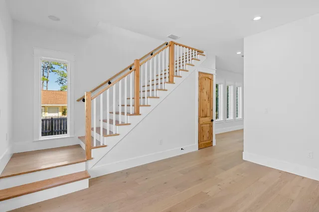 a bathroom with a sink a mirror and a light fixture