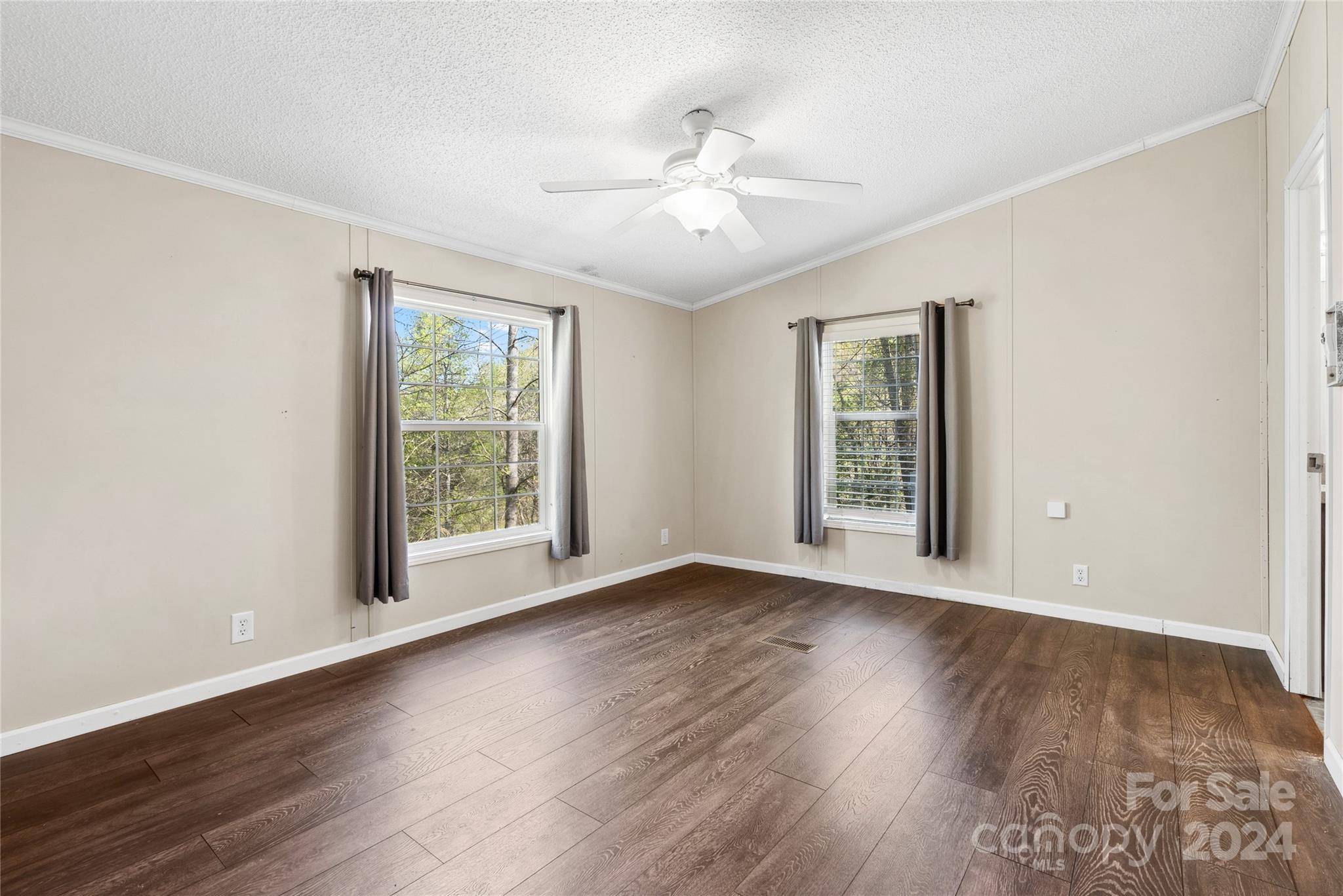3262 Windswept Ridge Road Marshall, NC 28753 - Photo 19 of 39 a view of an empty room with wooden floor and a window