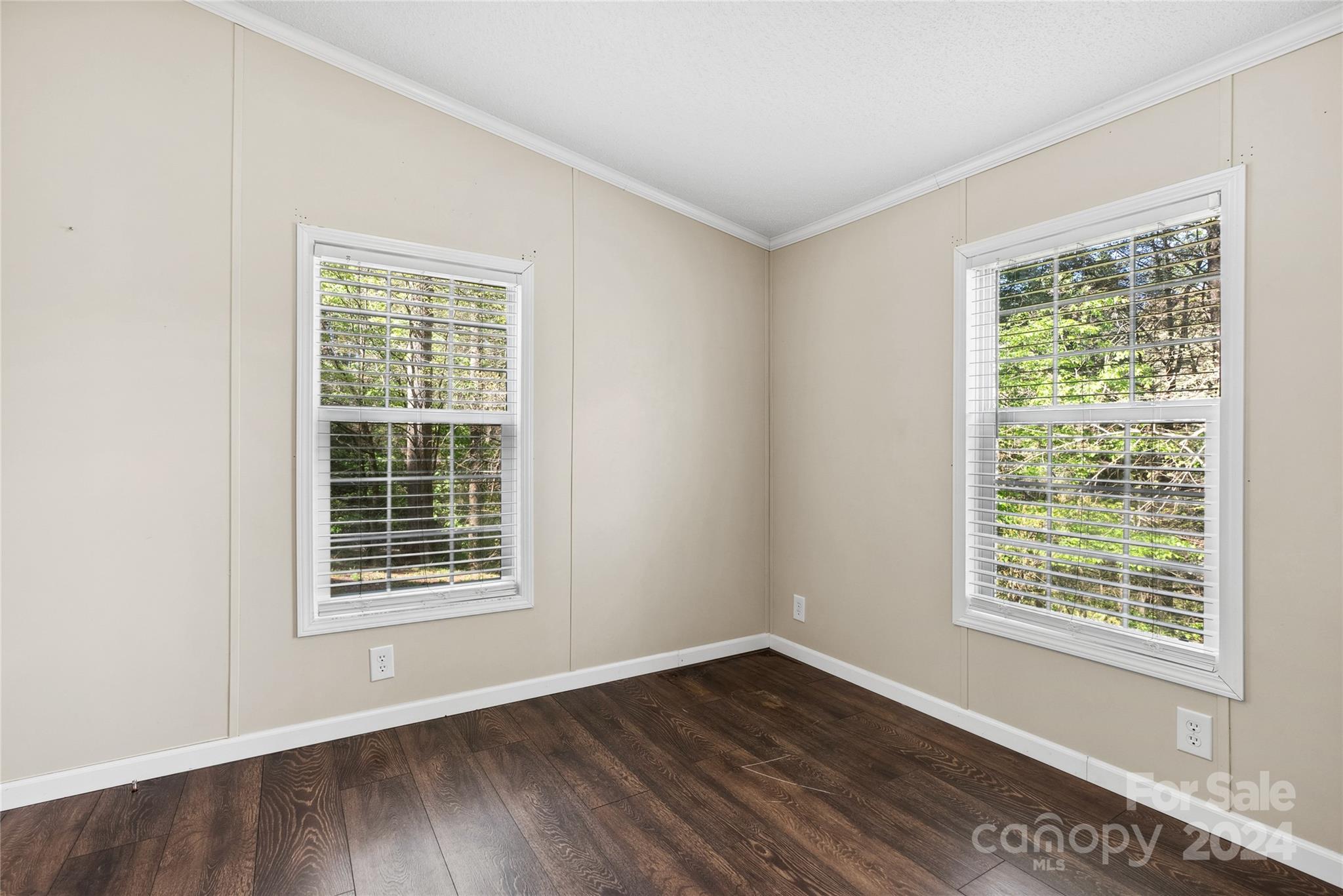 3262 Windswept Ridge Road Marshall, NC 28753 - Photo 31 of 39 a view of an empty room with wooden floor and a window