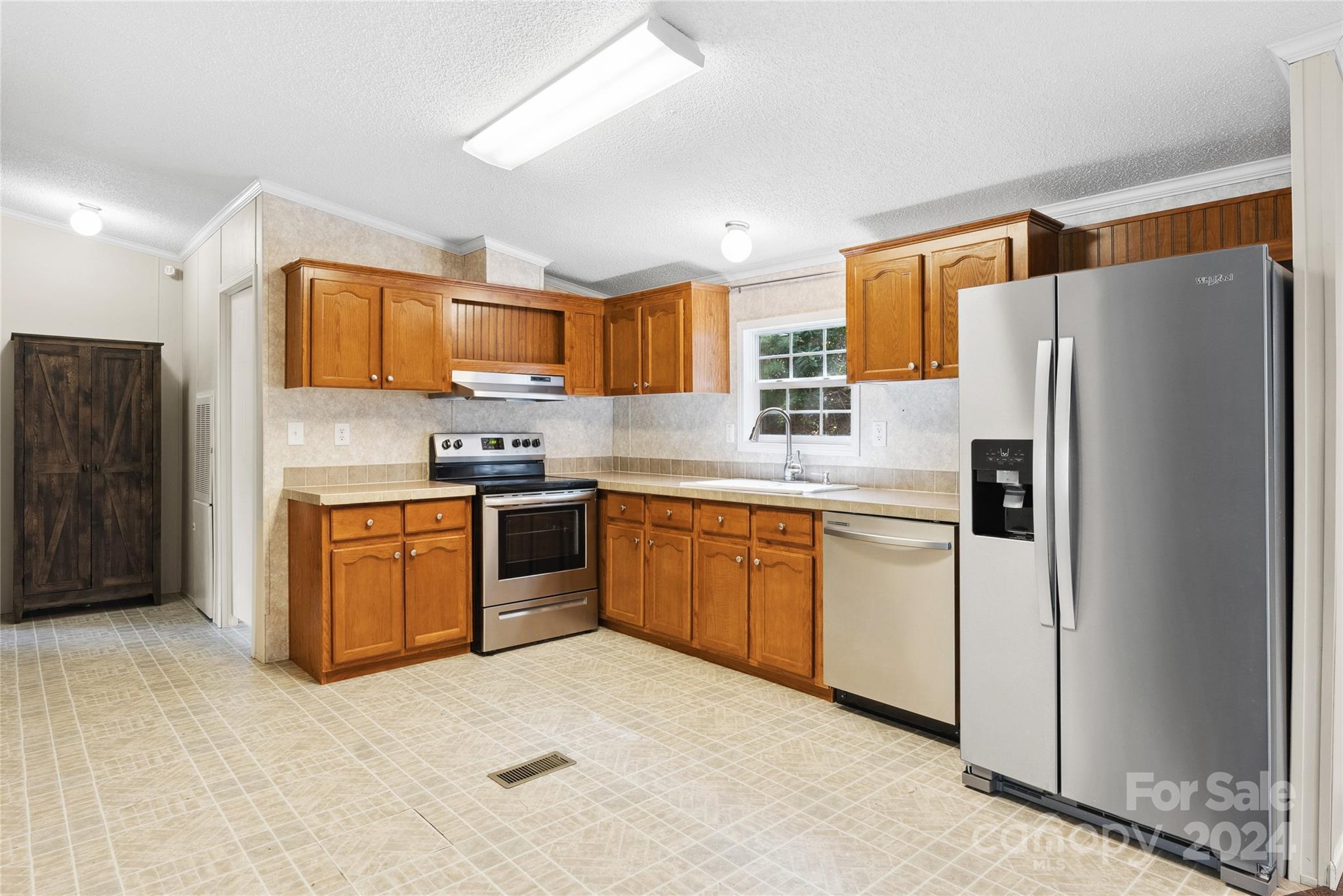 3262 Windswept Ridge Road Marshall, NC 28753 - Photo 8 of 39 a kitchen with stainless steel appliances granite countertop a refrigerator sink and stove