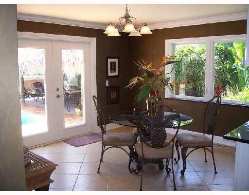 26 West High Point Road Sewall's Point, FL 34996 - Photo 3 of 8 a view of a dining room with furniture window and outside view