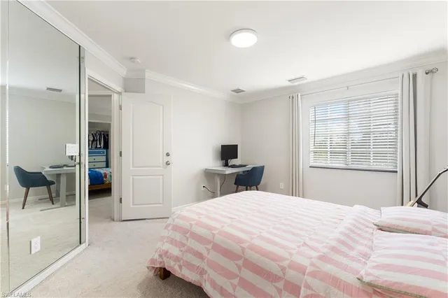 a bedroom with a bed and a chair